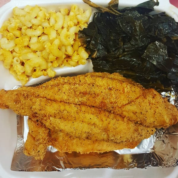 L&G Southern Soul Food's fried fish, macaroni and cheese, and collard greens in a takeout container.